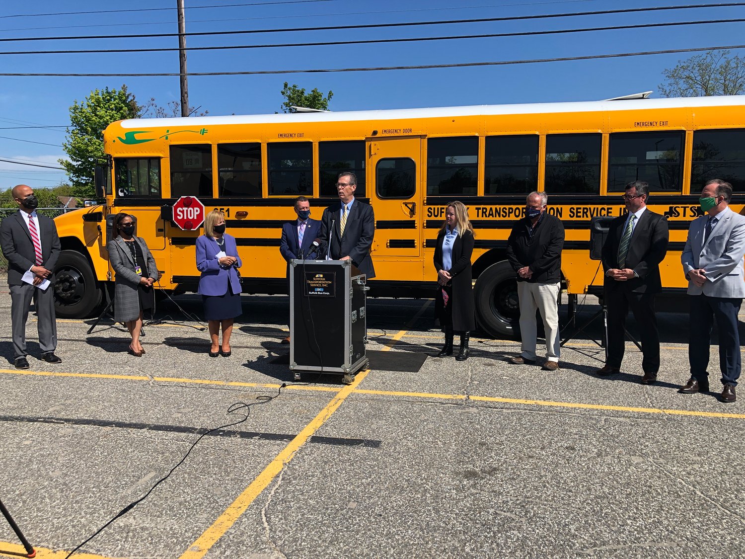 Bay Shore superintendent Joseph Bond speaks about the new electric bus fleet at a Tuesday, May 11 press conference in Bay Shore. The new “green” fleet is free to taxpayers, Bond said, and will save at least 8,000 gallons of diesel fuel and well over 54 metric tons of CO2 emissions.